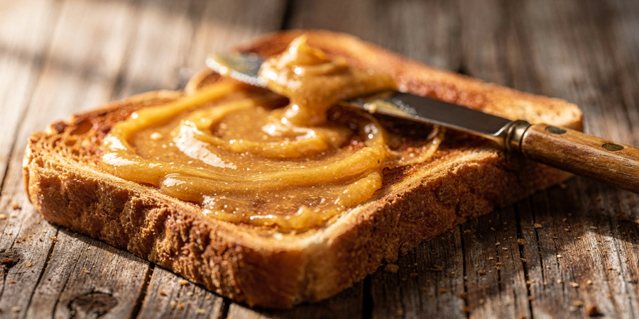 Slice of whole-grain toast spread with whipped honey